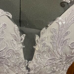 Elegant white Lace Dress
satin buttons all the way down the back